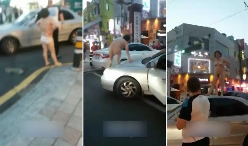 突然人が大勢いる街中で全裸になって車の上に乗り発狂しまくる韓国人女性のイカれ具合がエグくて見ちゃいられない・・・