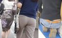 Young mom peeks out from the waist of her jeans through her gray panties.