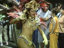 Passionate samba beauty dances crazy drenched in sweat in exhibitionism