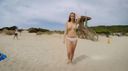 An exhibitionist work in which a fierce beautiful woman walks around with an embarrassed expression while being seen naked and her and are seen on a beach with many people!