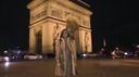 In Paris, France, the exposure of a beautiful woman who puts out her and dick in front of the Arc de Triomphe is so great that the exposure of the beautiful woman is so great that the grass w