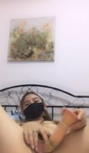 A goddess in a mask with attractive dark eyes performs pitiful large open legs and vibrator masturbation in the cowgirl state A troubledly erotic self-portrait