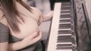Chinese girl with big in front of the piano