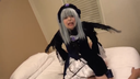 A cosplayer in a certain goth loli doll-style costume