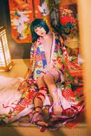 Beautiful girl like a Japan doll with gorgeous kimono and lustrous skin