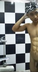 A handsome shaved who has an erection in the gym shower!