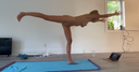 Beautiful woman naked yoga at home 2