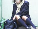Seated school girl casually shows her panties