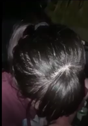 Black-haired girl with her hair tied up in clothes in car