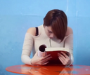 A beautiful woman who reads while being charged with an electric vibrator and can't stand it