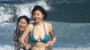 Women happily playing at the beach (3)