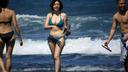 Women happily playing at the beach (3)