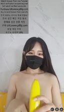 Beautiful busty beauty with beautiful long hair seduces with banana in one hand