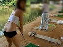 A gal is exposed and shows her ass to others while playing golf