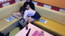 Personal shooting: Beautiful woman in uniform flirting with her boyfriend during karaoke