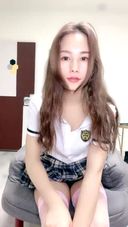 Selfie of Chinese beauty in long hair uniform costume, POV