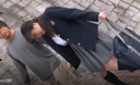 A girl in uniform with a vibrator takes a walk around the city while jerking her legs and deep throats in a public toilet