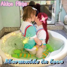 Mermaids in love Under their stage costumes they're wearing competitive swimsuits! Then they jump into the jacuzzi!
